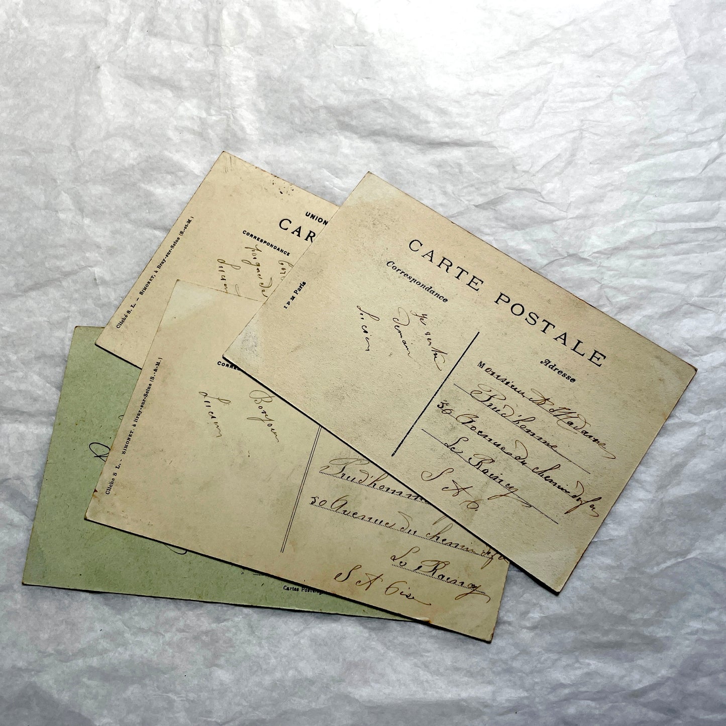 Lot of four 1910s French postcards showing black and white photographs of châteaux and grand estates in France.