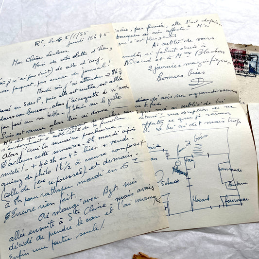 1950s French handwritten letters set with envelopes, vintage stamps, and postmarks. Historical correspondence.