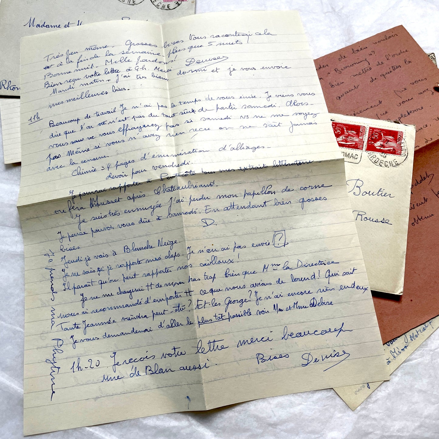 Set of 1940s vintage French letters with envelopes, featuring handwritten text, original stamps, and postmarks.