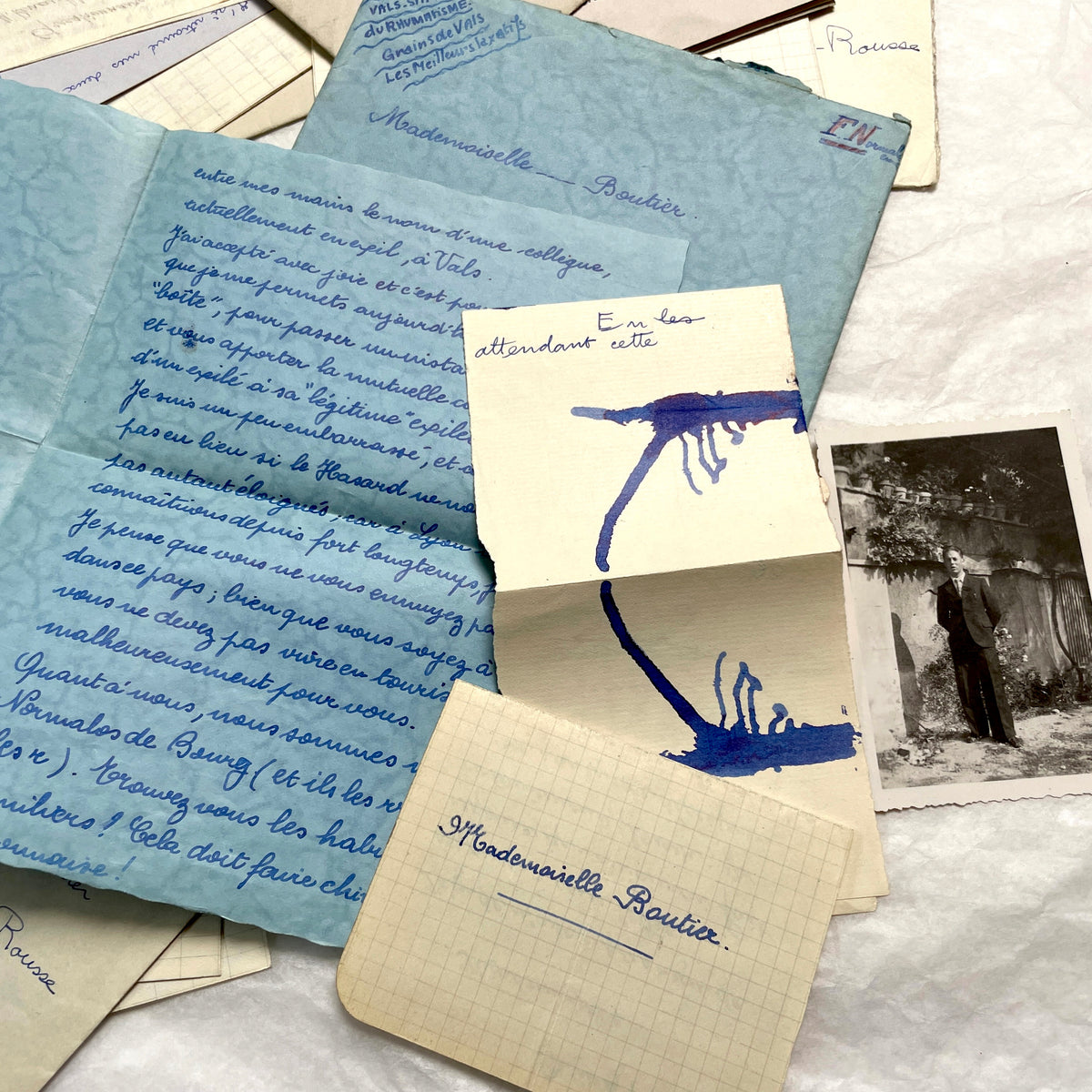 Set of 1930s vintage letters and envelopes with French and English handwriting and period stamps, historical ephemera.