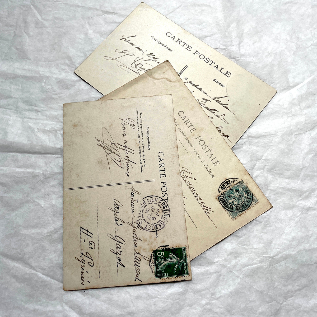 Lot of three 1900s French postcards showing Versailles Grand Trianon, Petit Trianon, and a Paris Montparnasse view.