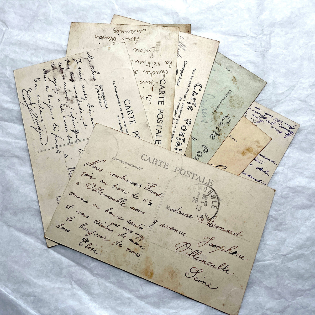 Lot of 8 1910s French postcards showing various historic town views, architecture, and landscapes with stamps.