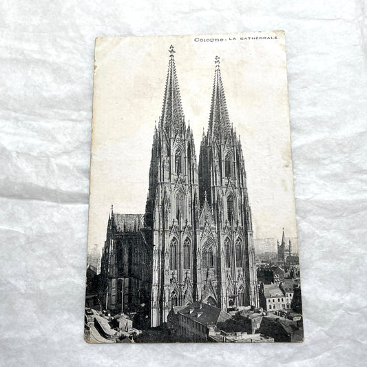 Four 1900s vintage postcards featuring detailed black and white views of European Gothic cathedrals and iconic towers.
