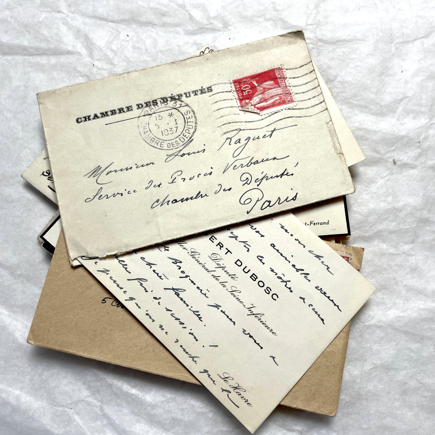 Lot of 10 French 1930s miniature envelopes with handwritten notes, business cards, and vintage stamps.