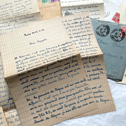 Set of 1940s French handwritten letters with original envelopes and stamps, showcasing vintage European correspondence.