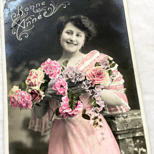 1910s - French New Year Postcard - Belle Epoque Hand-Tinted Smiling Woman - Pink Dress - Floral Bouquet - Elegant Vintage Collectible
