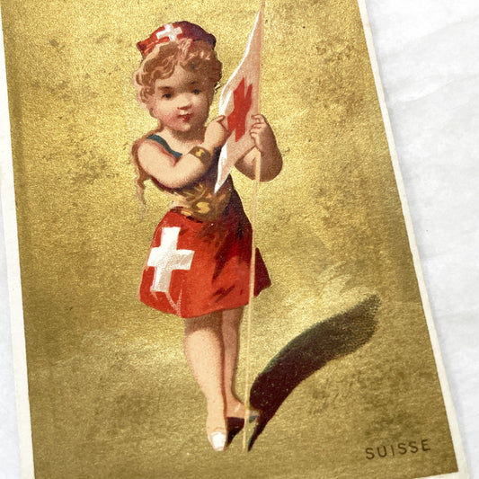 1900s - Vintage Chromo - Little Swiss Girl in Traditional Dress Holding Flag - Golden Background - Collectible Ephemera