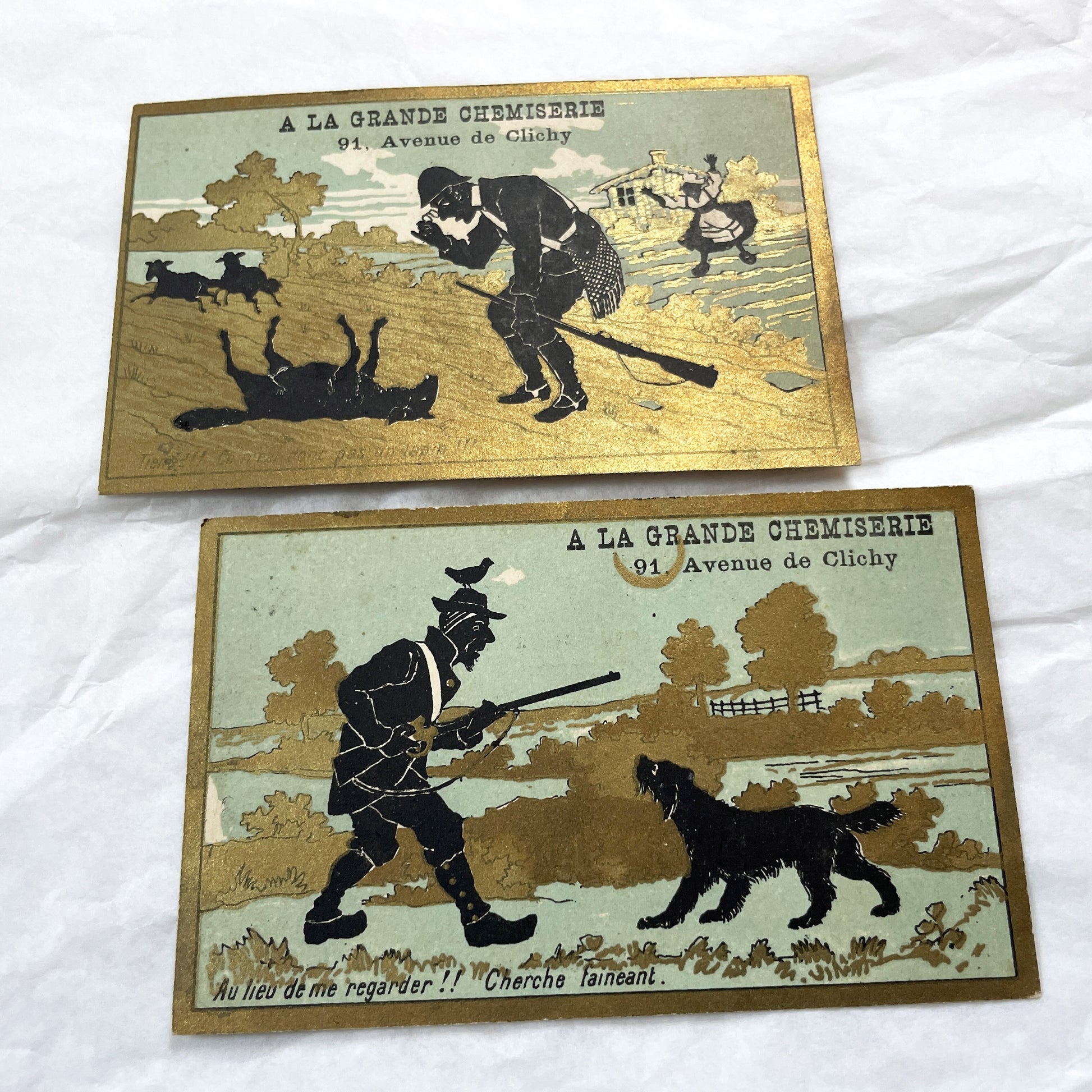 Late 19th - Two Parisian Advertising Cards - A La Grande Chemiserie - Humorous Hunting Scenes - Black Silhouette Art - Gold Embellishments