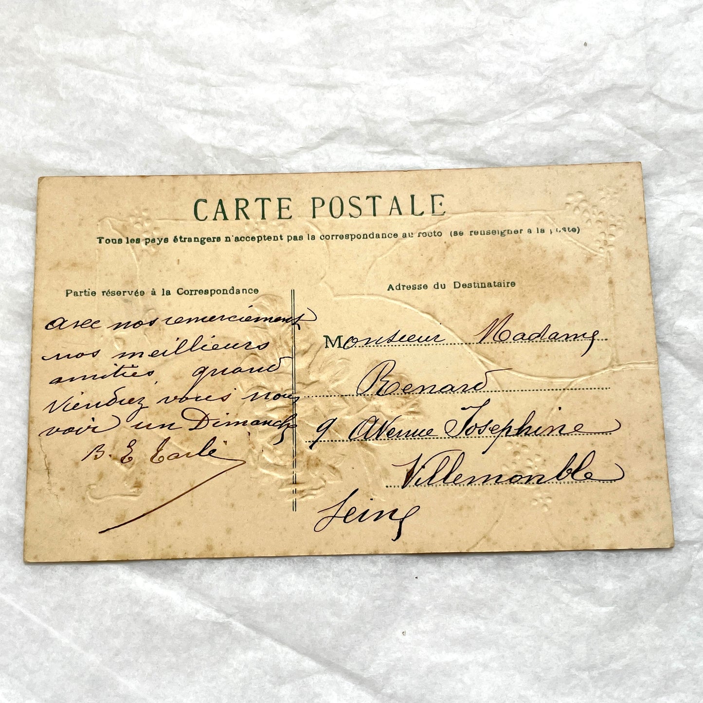 1910s French postcard with embossed roses in a vase, gilded decorative elements, a landscape vignette, and a red French stamp