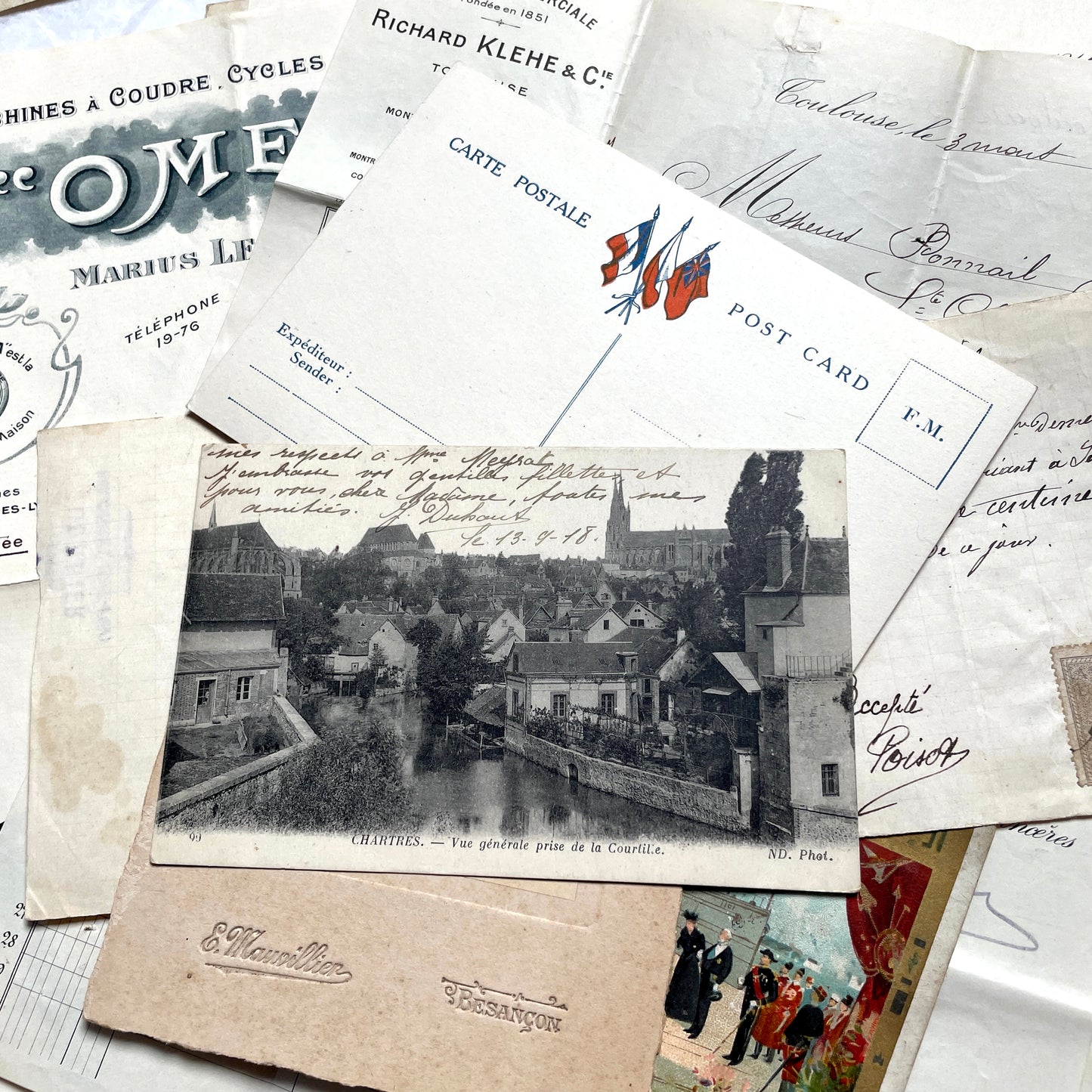 1910s French documents lot with vintage postcards, handwritten letters, business papers, and historical photos.