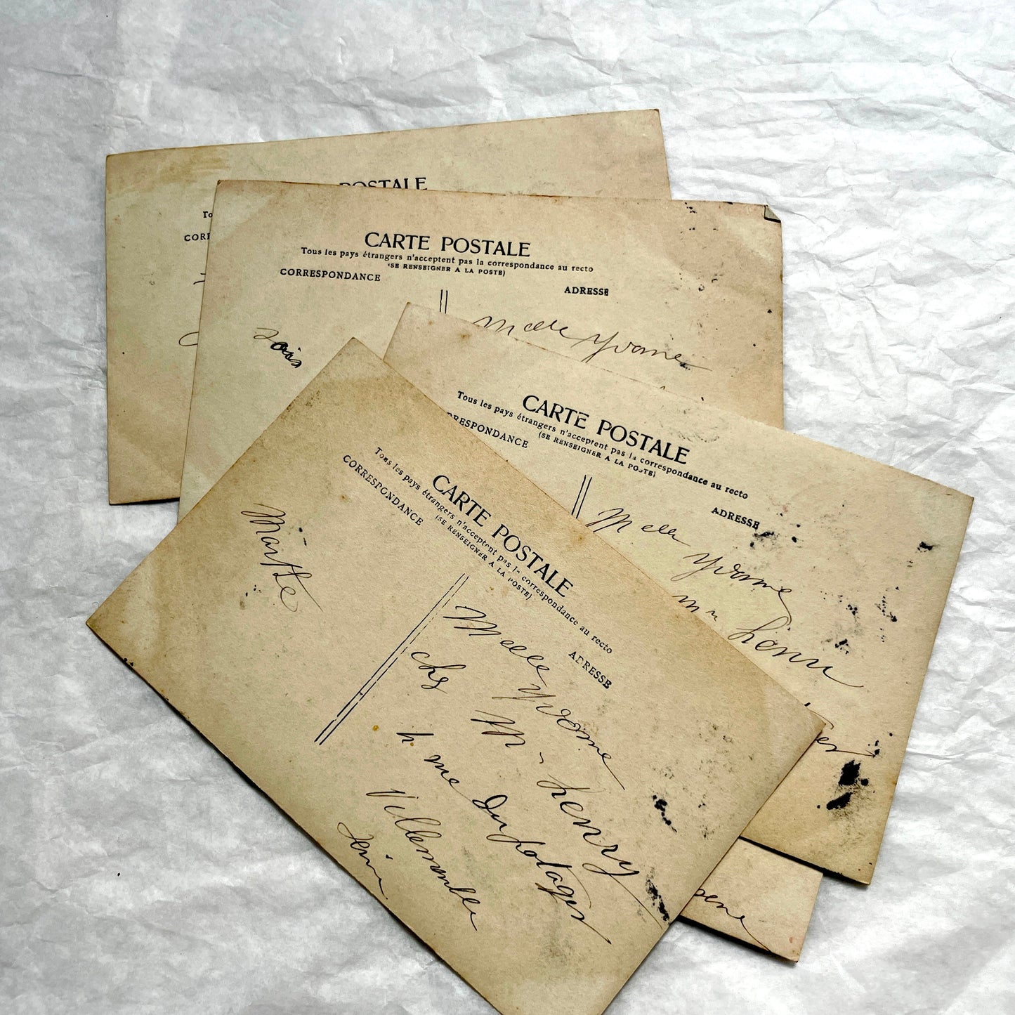 1910s French postcard lot of 5, featuring sepia-toned photos of a grandmother and granddaughter in daily scenes.