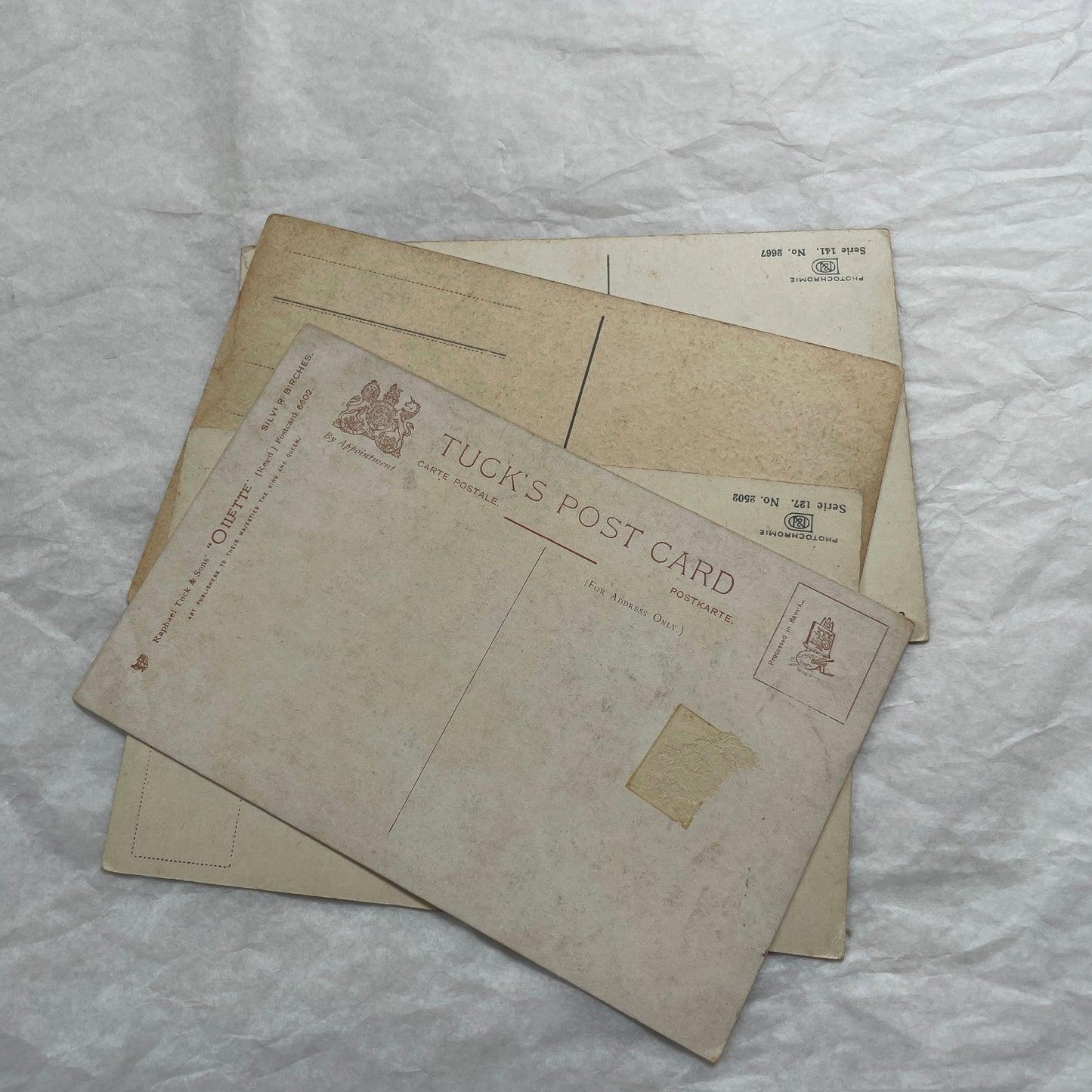 1900s Lot of Four Postcards - Diverse European Landscapes with Seasons, including a castle and snowy mountains.