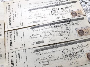 Set of 10 French bills of exchange a bookshop of the city of Dijon from 1930s with tax stamps and rubber-stamps