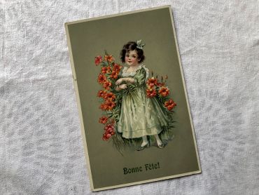 Vintage Belgian postcard with young girl with a bouquet of flowers from 1910