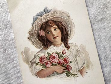 Vintage Belgian postcard with young girl with a bouquet of flowers from 1900s