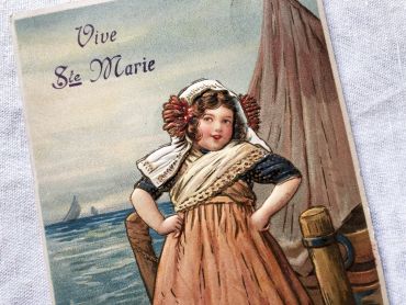 Vintage Belgian embossed postcard with an illustration representing a young girl a young girl going to sell the fishing fish