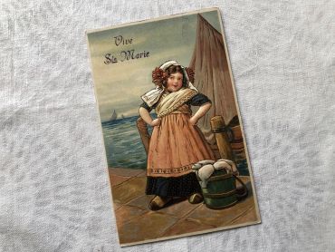 Vintage Belgian embossed postcard with an illustration representing a young girl a young girl going to sell the fishing fish