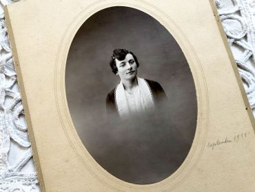 Old French photograph of a young woman of the middle class made