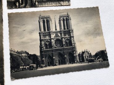 Set of 4 Vintage French postcards of Paris from 1950s with Notre-Dame, the Sacré-Coeur and the Carroussel du Louvre.