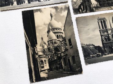 Set of 4 Vintage French postcards of Paris from 1950s with Notre-Dame, the Sacré-Coeur and the Carroussel du Louvre.