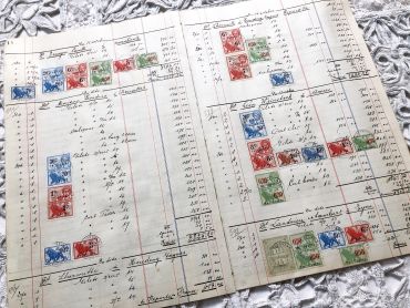 4 pages of a large Belgian ledger from the 1930s with numerous tax stamps