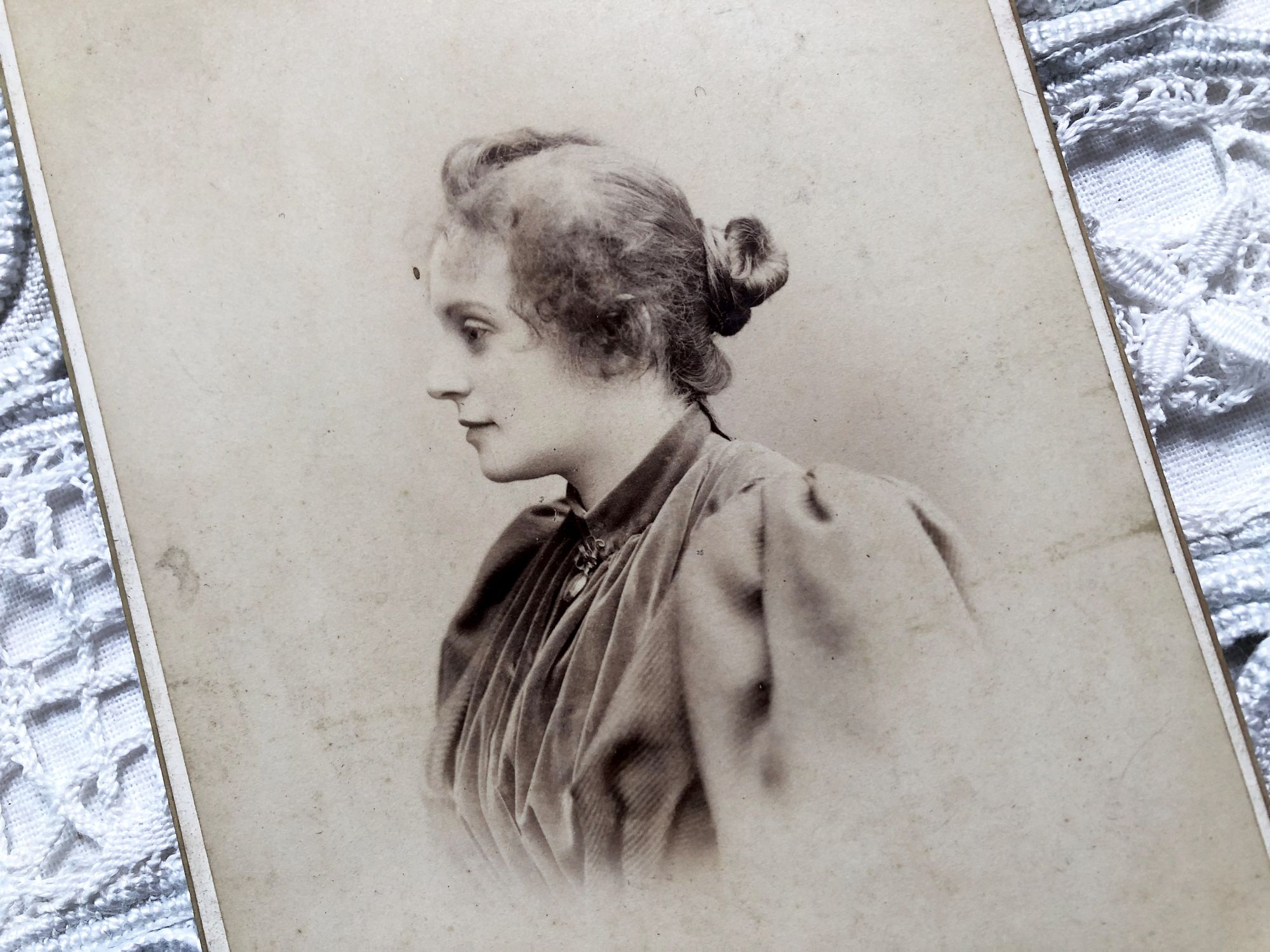 Beautiful photographic portrait of a young woman of the early twentieth century with richly decorated back Beautiful photographic portrait of a young woman of the early twentieth century with richly decorated back