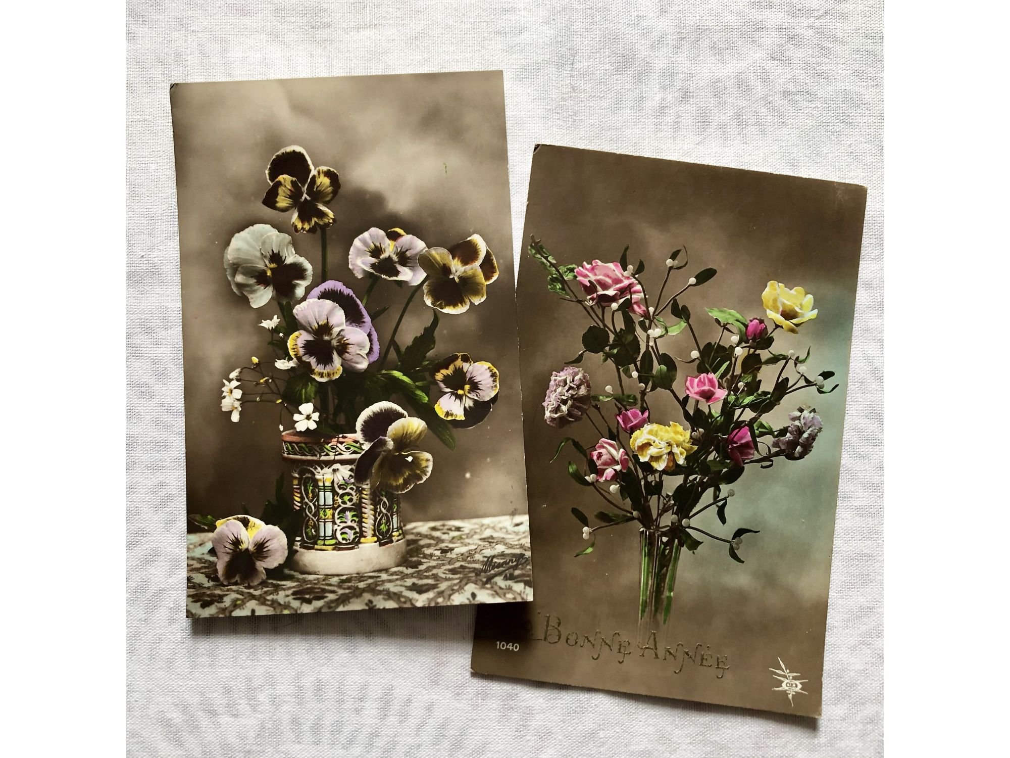 Two vintage French postcard depicting a bouquet of flowers (pansy flowers, roses, poenies) from 1910s Two vintage French postcard depicting a bouquet of flowers (pansy flowers, roses, poenies) from 1910s