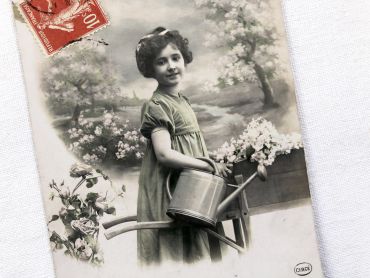 France postcard with a young girl carrying a watering can from 1910s
