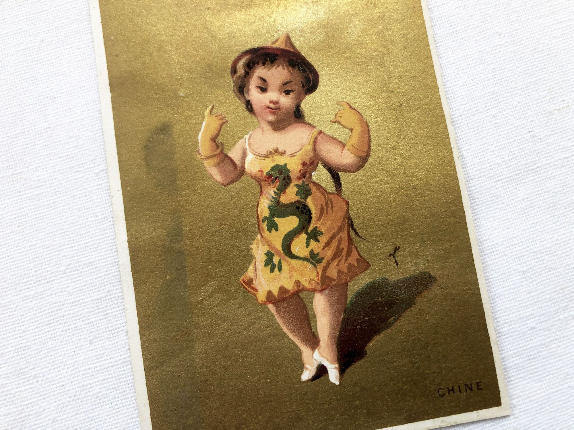 Vintage French chromolithograph with a young lady representing China with golden background from 1890s