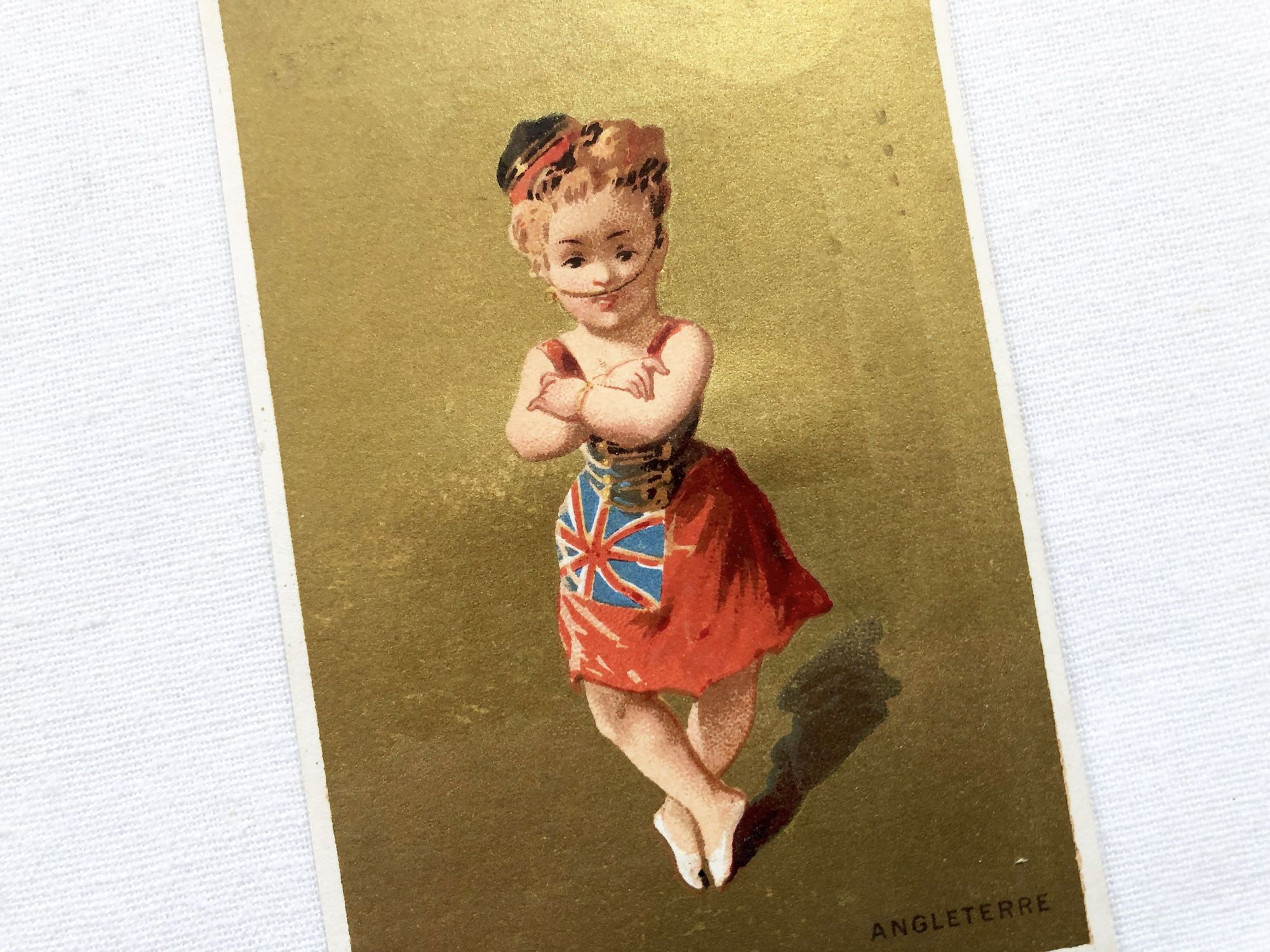 Vintage French chromolithograph with a young lady representing the United Kingdom with golden background from 1890s