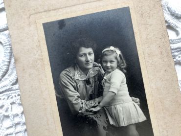 Old French photograph of a mother and daughter in the 1920s made by the photographer Emile Mauvillier in Besançon