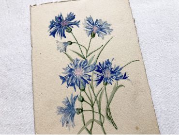 Vintage French postcard with a small bouquet of blue flowers from 1920s