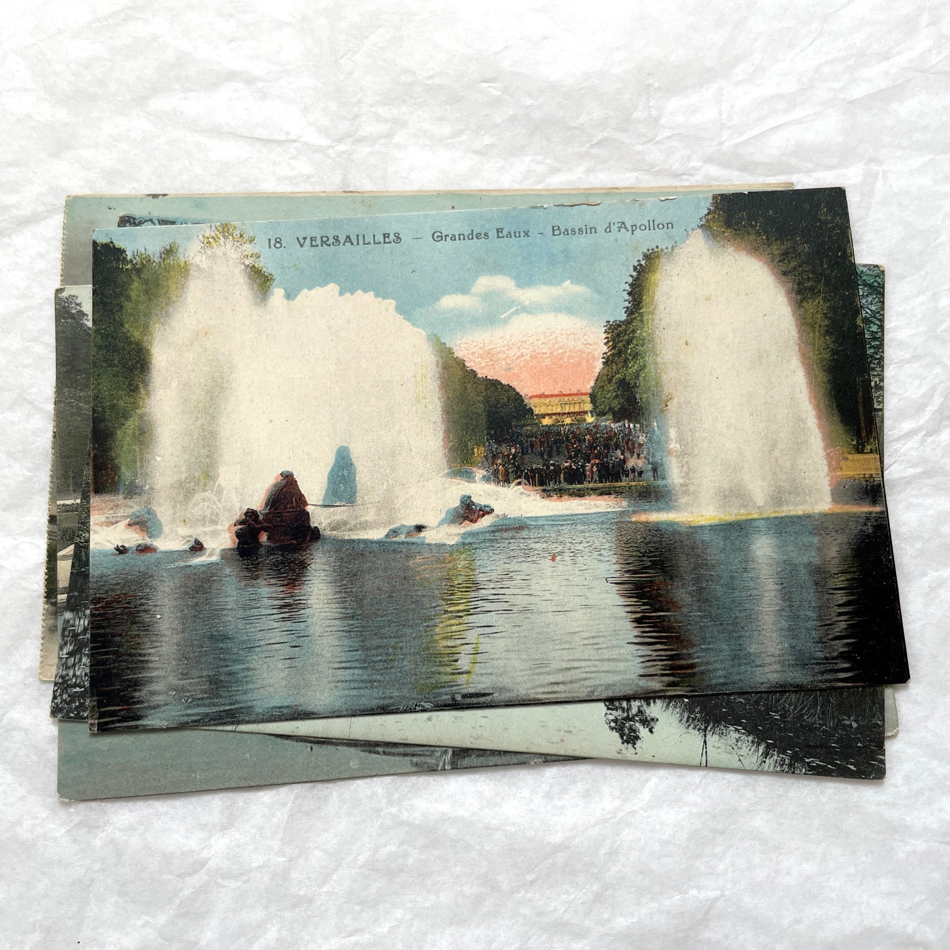 1910s French postcards lot featuring Versailles Palace, Petit Trianon, and grand fountains like Latona and Apollo's Basin.