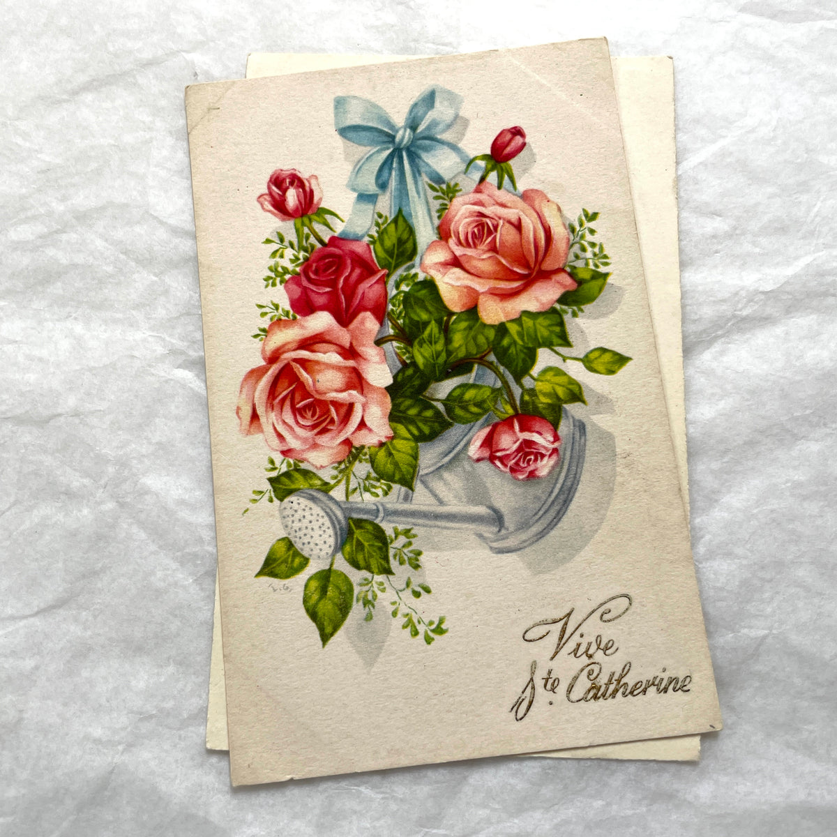 Two 1910s vintage French postcards featuring colorful floral designs, one with anemones for birthday, another with roses in a