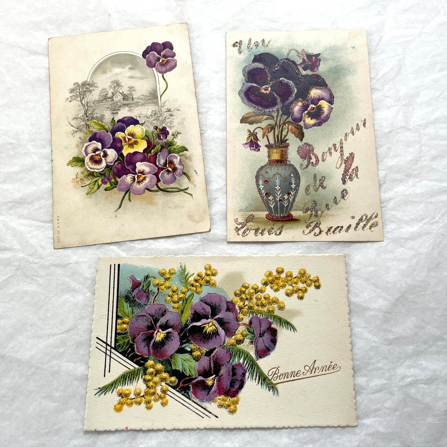 1900s French postcards lot featuring vibrant pansy floral designs and French greetings.