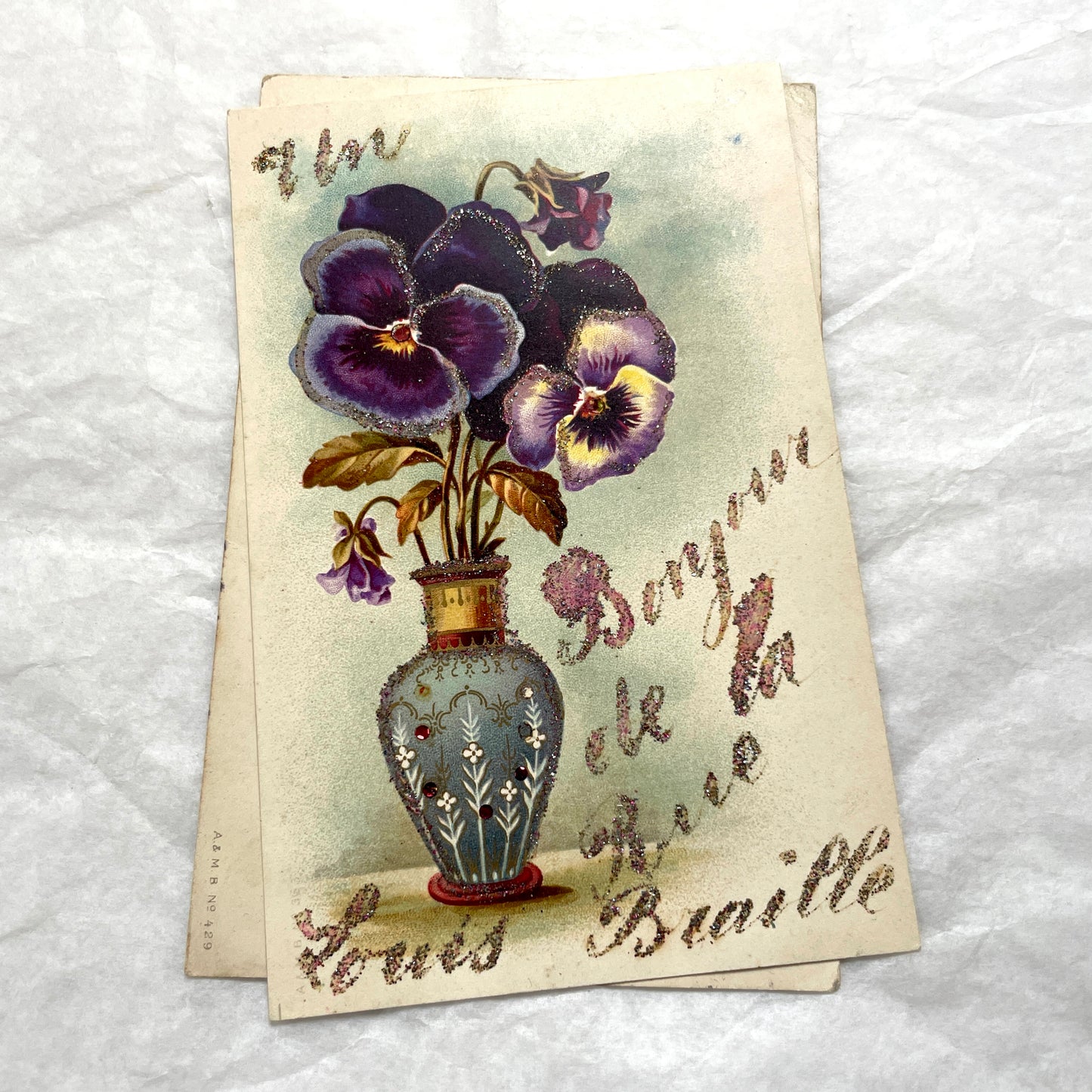 1900s French postcards lot featuring vibrant pansy floral designs and French greetings.