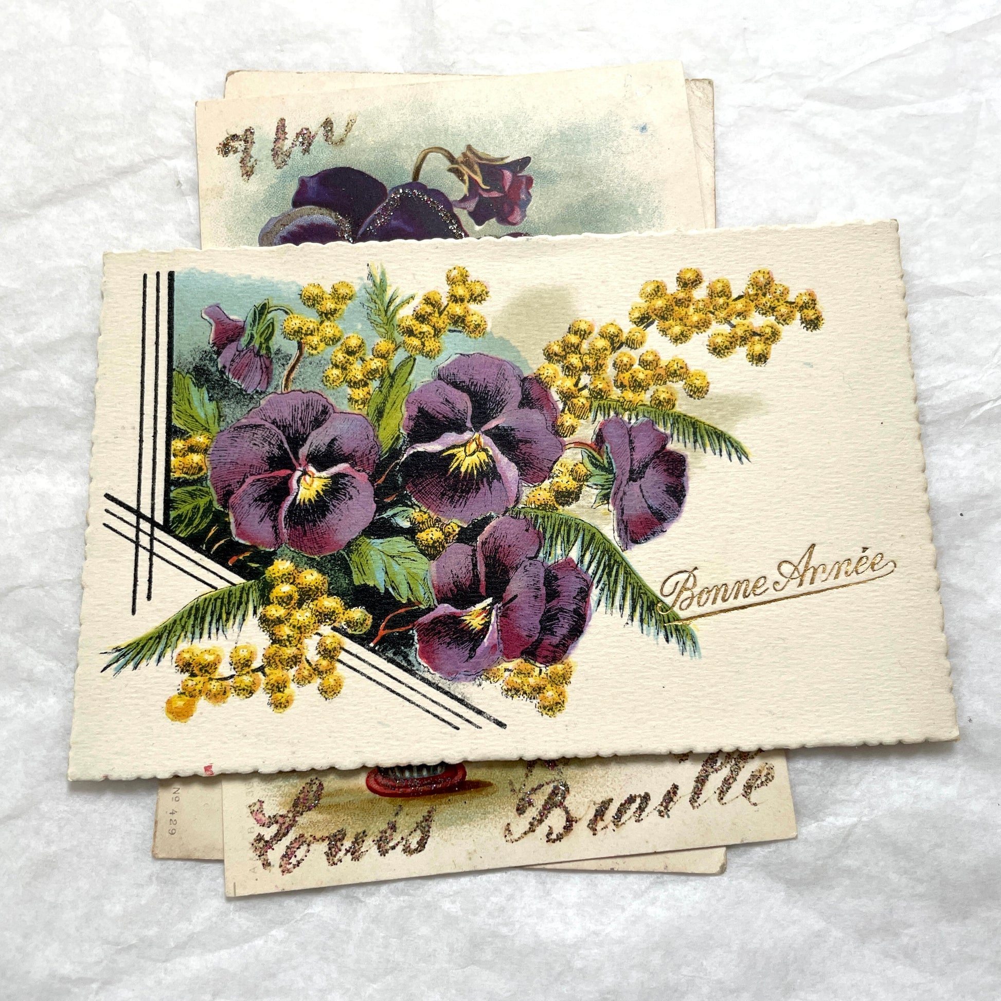 1900s French postcards lot featuring vibrant pansy floral designs and French greetings.