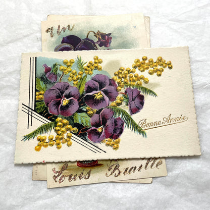 1900s French postcards lot featuring vibrant pansy floral designs and French greetings.