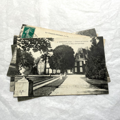 Lot of four 1910s French postcards showing black and white photographs of châteaux and grand estates in France.