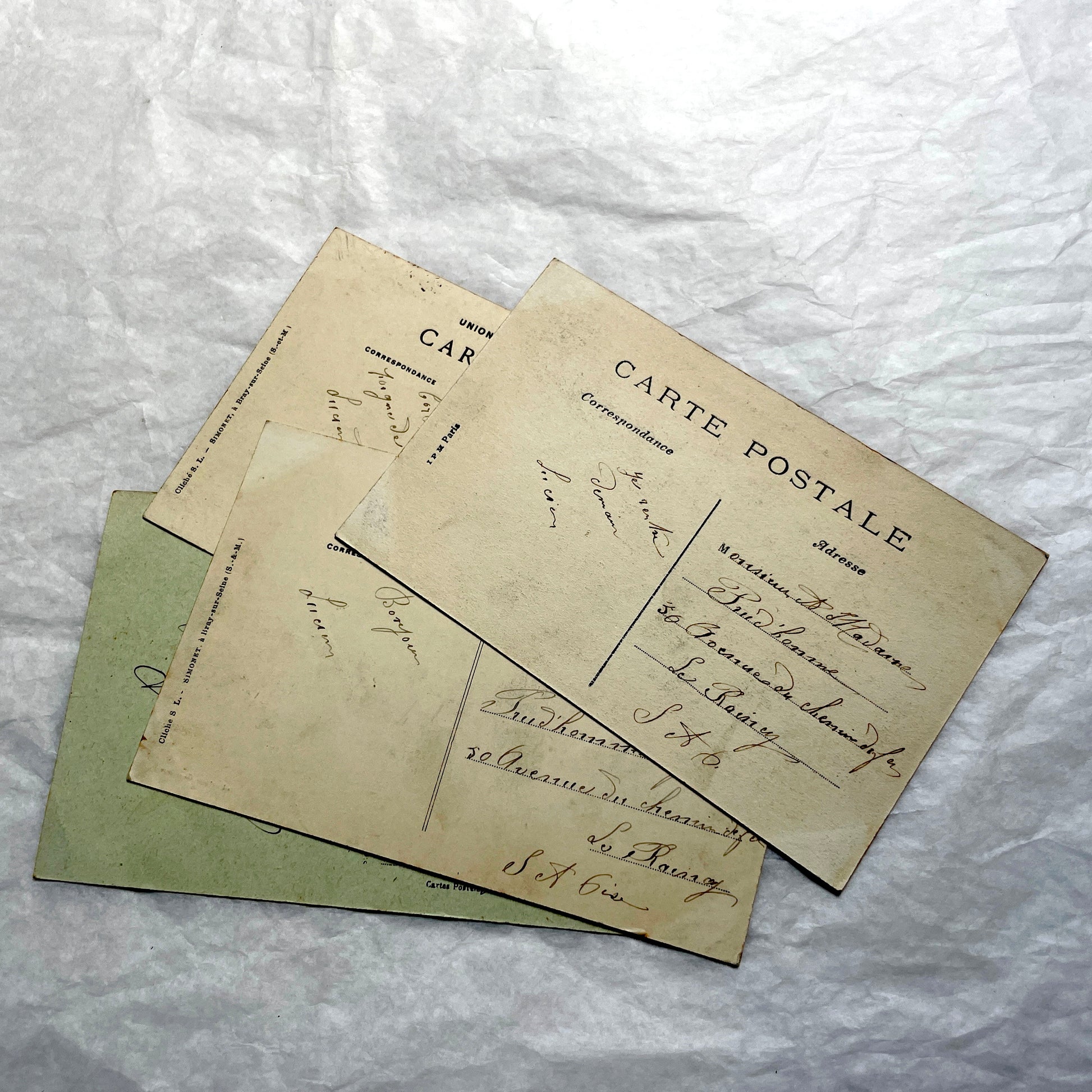 Lot of four 1910s French postcards showing black and white photographs of châteaux and grand estates in France.