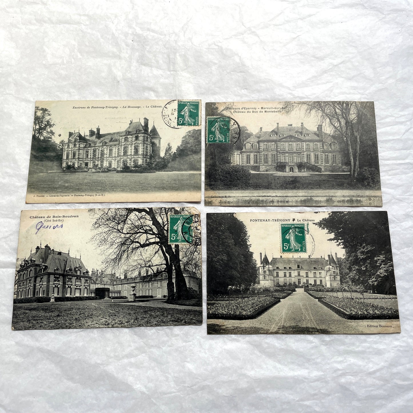 Lot of 1920s vintage French postcards depicting various historic châteaux and castles in sepia tones.