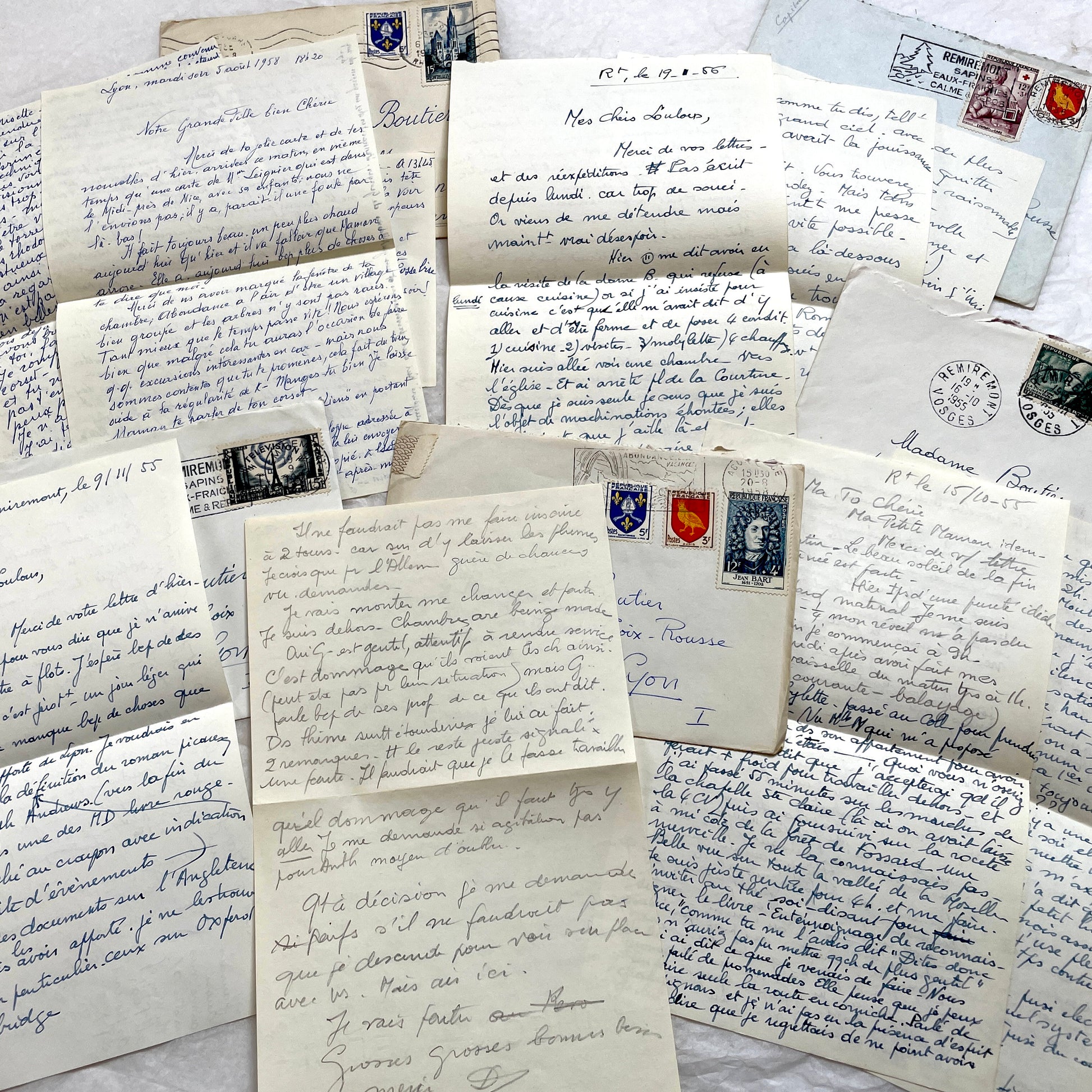 Set of 1950s French handwritten letters and envelopes with stamps. Vintage paper ephemera for collectors.