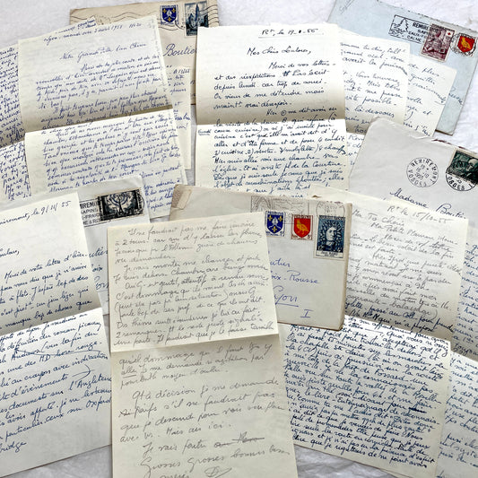Set of 1950s French handwritten letters and envelopes with stamps. Vintage paper ephemera for collectors.