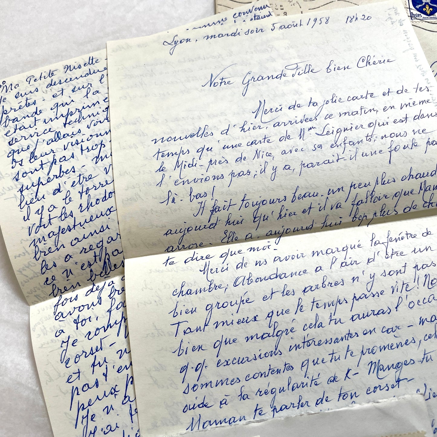 Set of 1950s French handwritten letters and envelopes with stamps. Vintage paper ephemera for collectors.