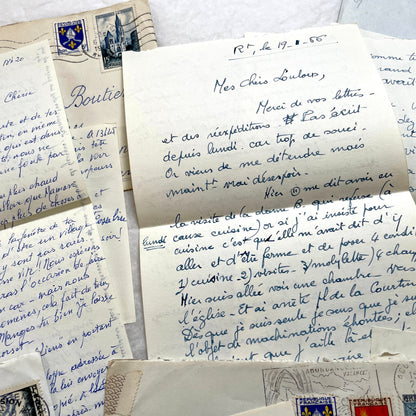 Set of 1950s French handwritten letters and envelopes with stamps. Vintage paper ephemera for collectors.
