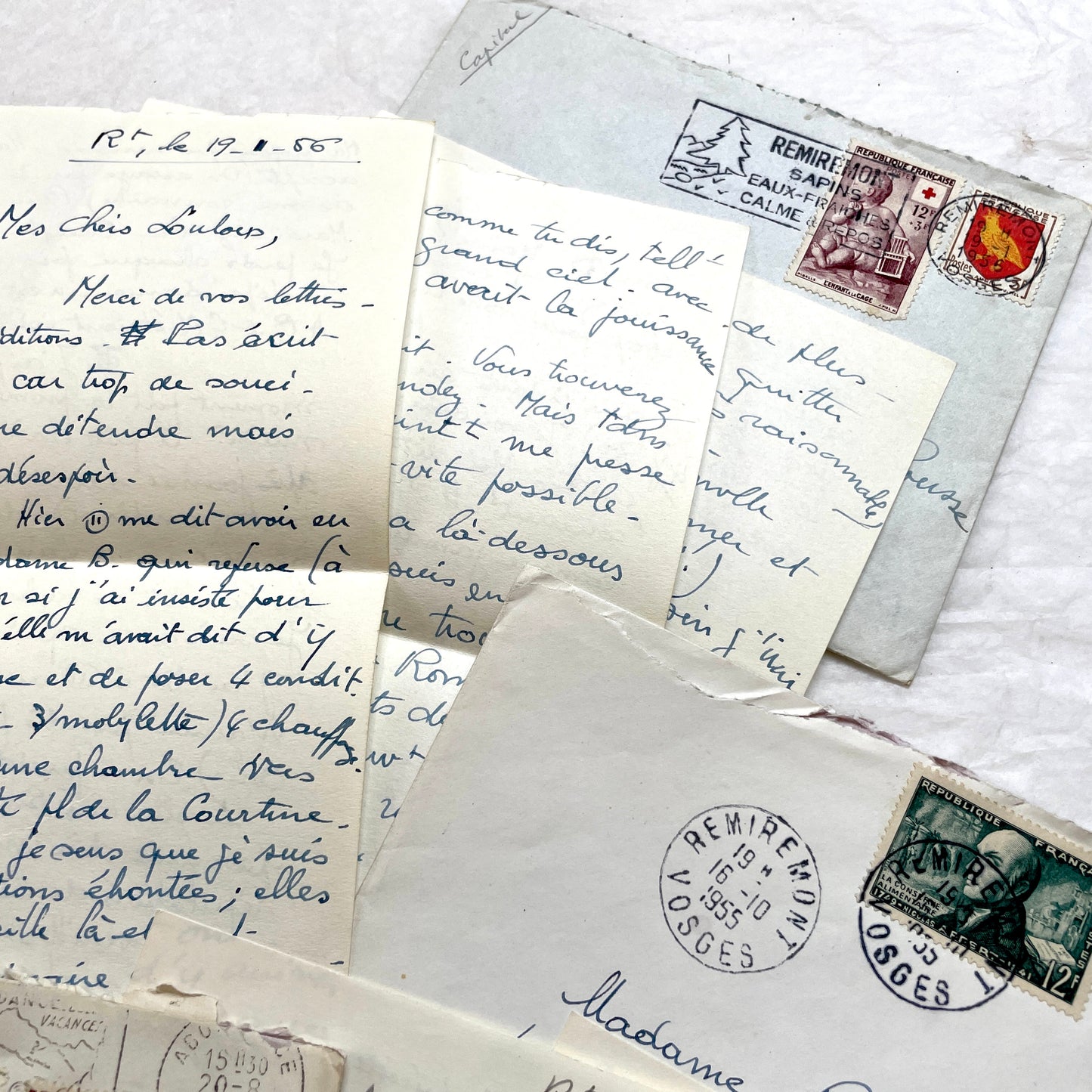 Set of 1950s French handwritten letters and envelopes with stamps. Vintage paper ephemera for collectors.