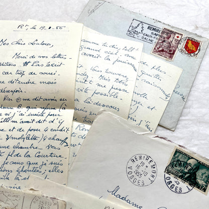 Set of 1950s French handwritten letters and envelopes with stamps. Vintage paper ephemera for collectors.