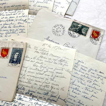 Set of 1950s French handwritten letters and envelopes with stamps. Vintage paper ephemera for collectors.