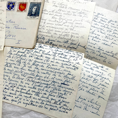 Set of 1950s French handwritten letters and envelopes with stamps. Vintage paper ephemera for collectors.