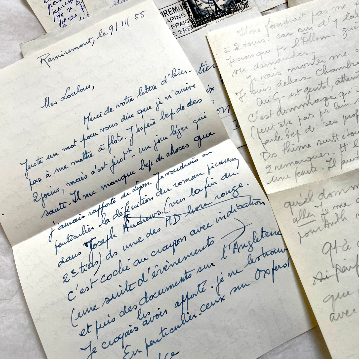 Set of 1950s French handwritten letters and envelopes with stamps. Vintage paper ephemera for collectors.